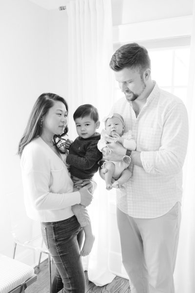 A mom, and dad, looking at their son and daughter in Westfield NJ.