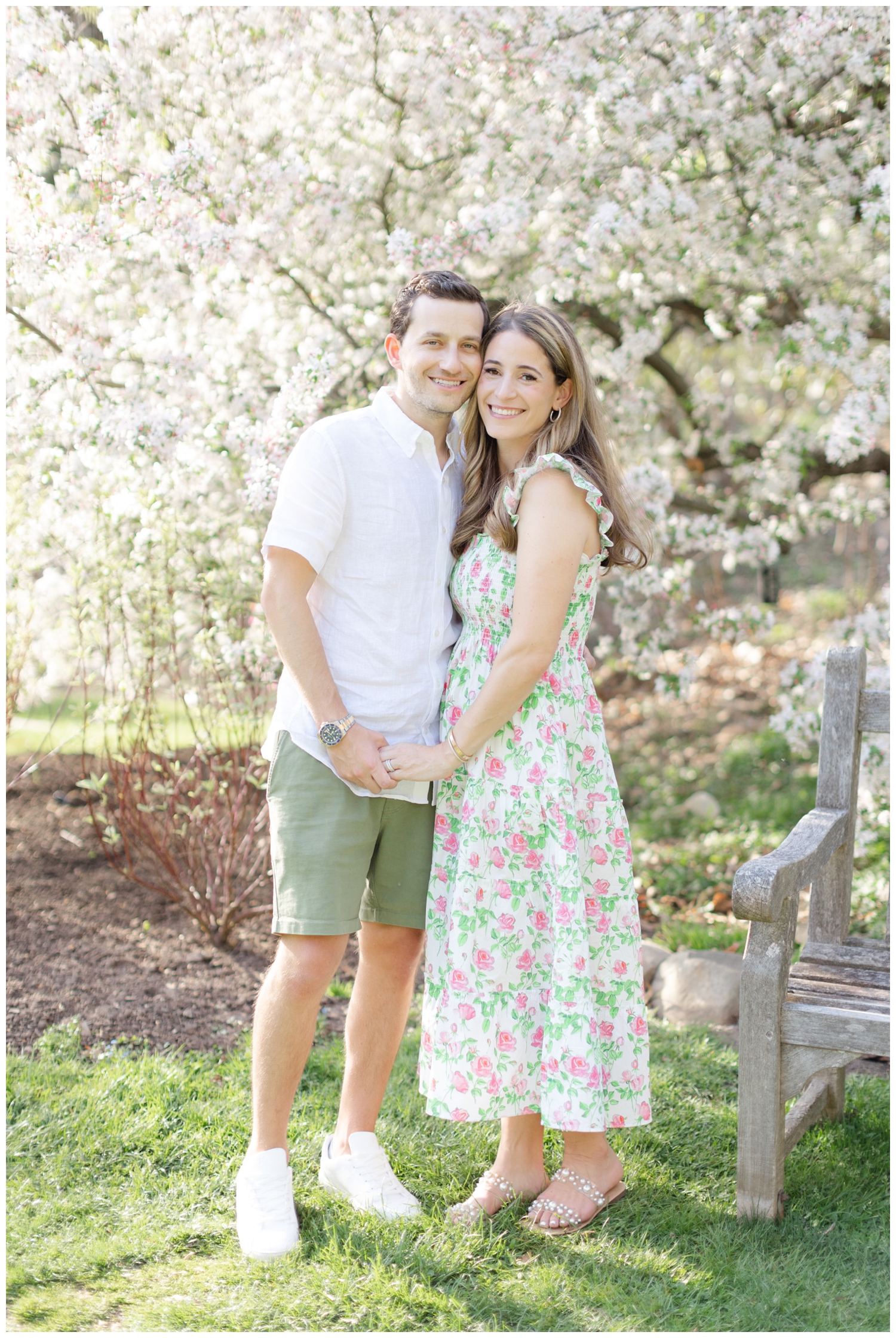 Husband and wife smile while at Reeves Reed Arboretum in Summit NJ.