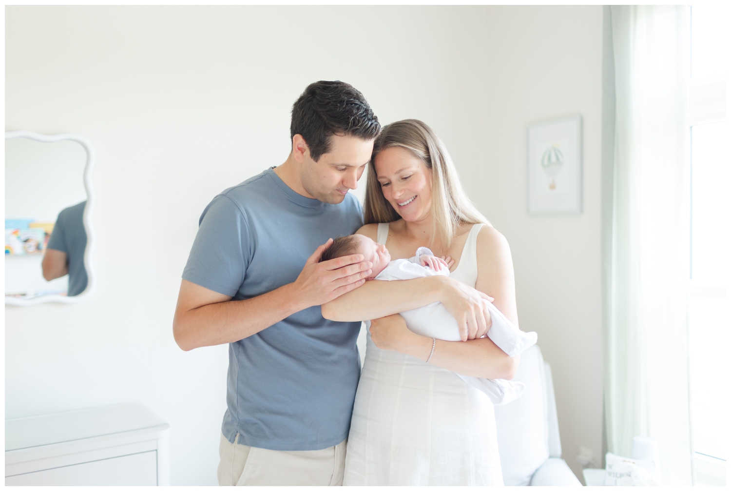 New parents with their newborn son with morristown newborn photographer Erin Dwyer Photography.