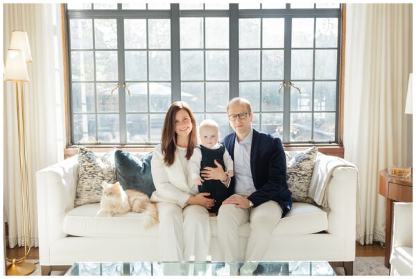Parents smiling with their young baby boy for an in-home family session in Summit NJ.